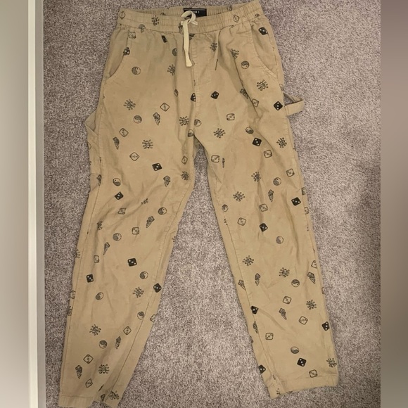 Forever 21 beige corduroy pants with mushroom, yin yang, and dice prints on it. - Picture 1 of 3